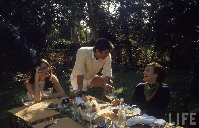 Film director Robert Evans having lunch at home with live-in girlfriend Libby Boehmer-- Beverly Hills, CA 1968.