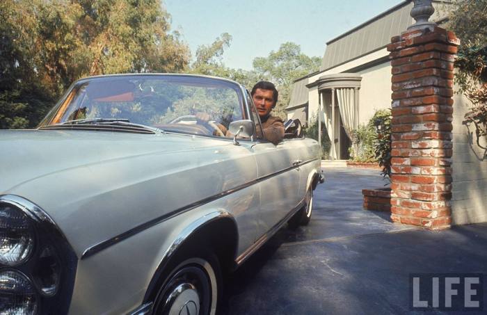 VP of Paramount Pictures Robert Evans leaving home in his Mercedes Benz convertible-- Beverly Hills, CA 1968..