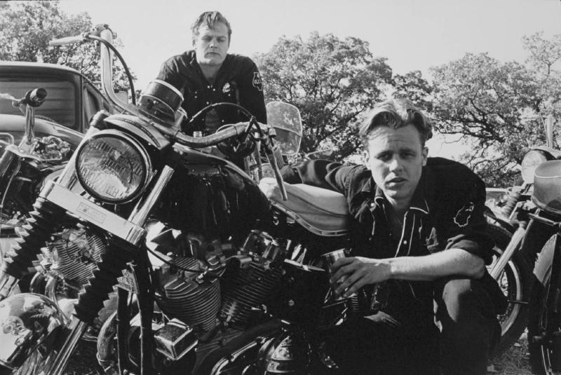"Brucie, his CH, and Crazy Charlie, McHenry, Illinois"  from The Bikeriders by Danny Lyon  --circa 1965-66.