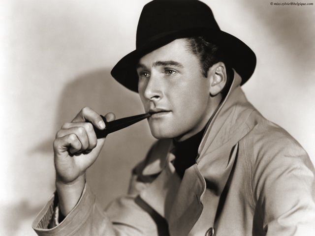 The always suave, Errol Flynn smoking in style.